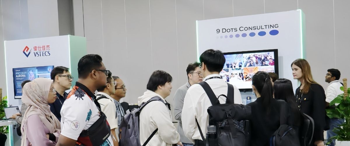 Visitors at the 9 Dots Consulting booth during Microsoft AI Tour Kuala Lumpur 2025