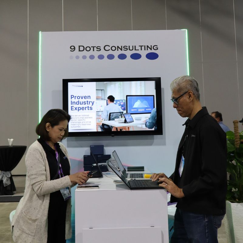 Visitors at the 9 Dots Consulting booth during Microsoft AI Tour Kuala Lumpur 2025