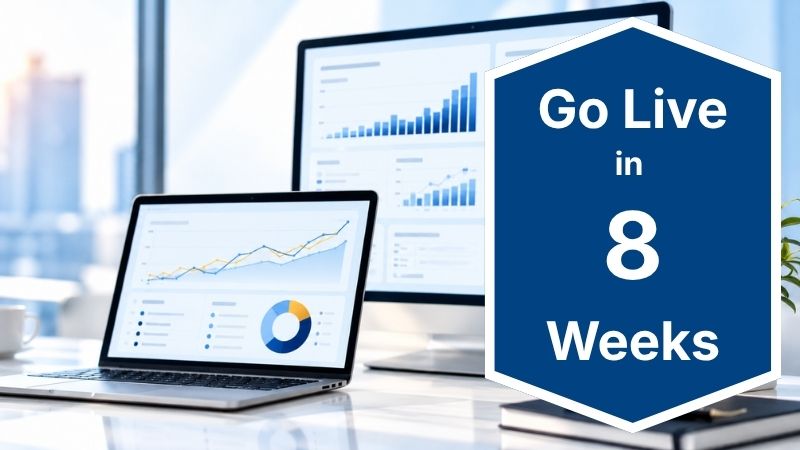 Finance dashboards on a monitor and laptop with a badge showing Jumpstart Finance goes live in 8 weeks